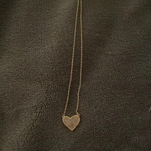 pink Kendra Scott rose quartz heart necklace.